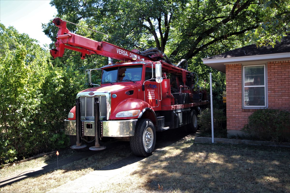 Excel Geothermal's drilling rig set up beside Jim Barnes' 1954 brick home in Dallas