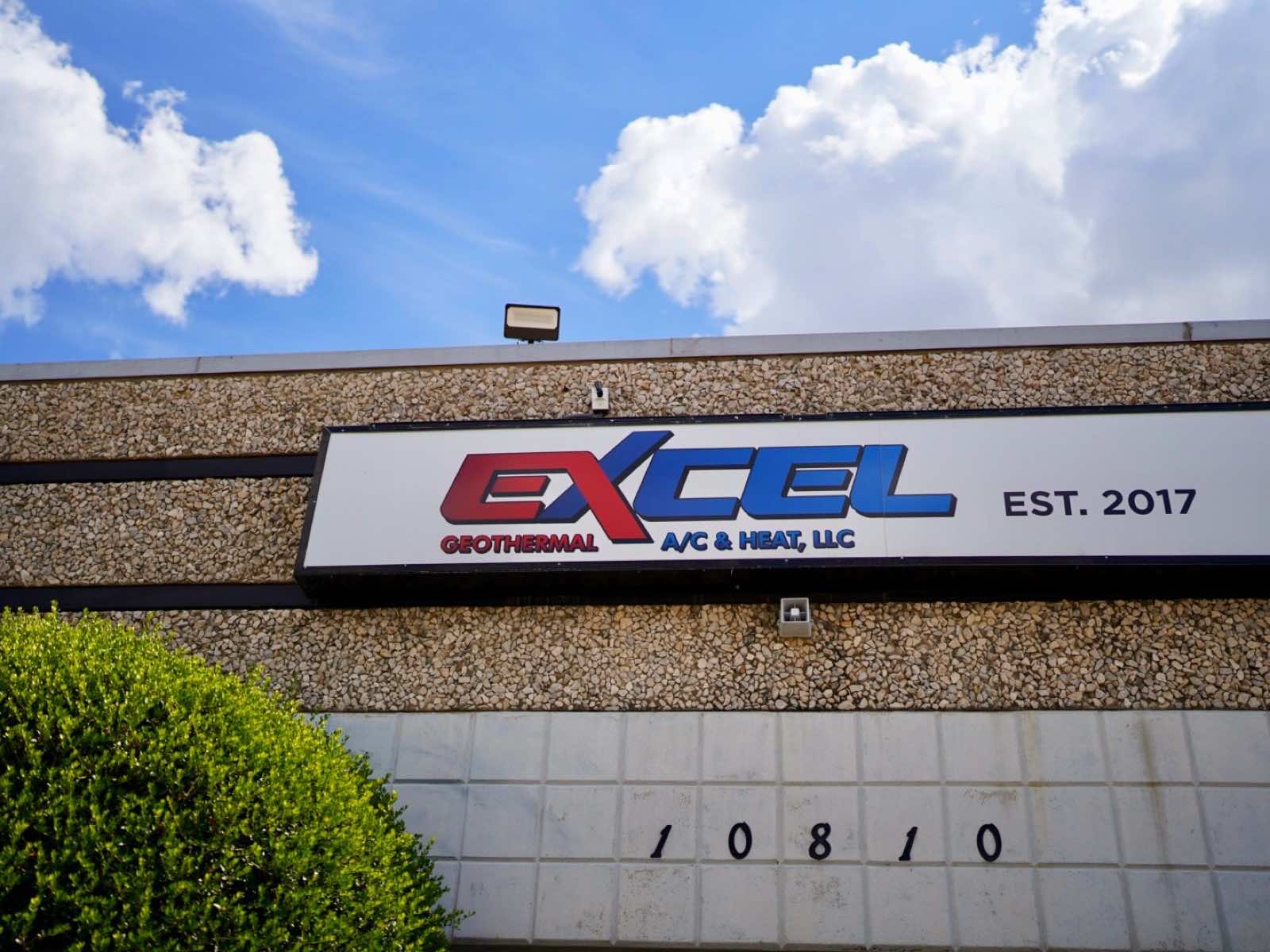 Excel Geothermal A/C & Heat sign on the company's Dallas headquarters building
