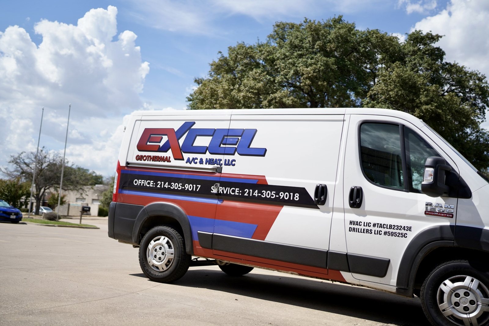 Excel Geothermal service van with office and service phone numbers lettered on the side, parked under oaks in Dallas