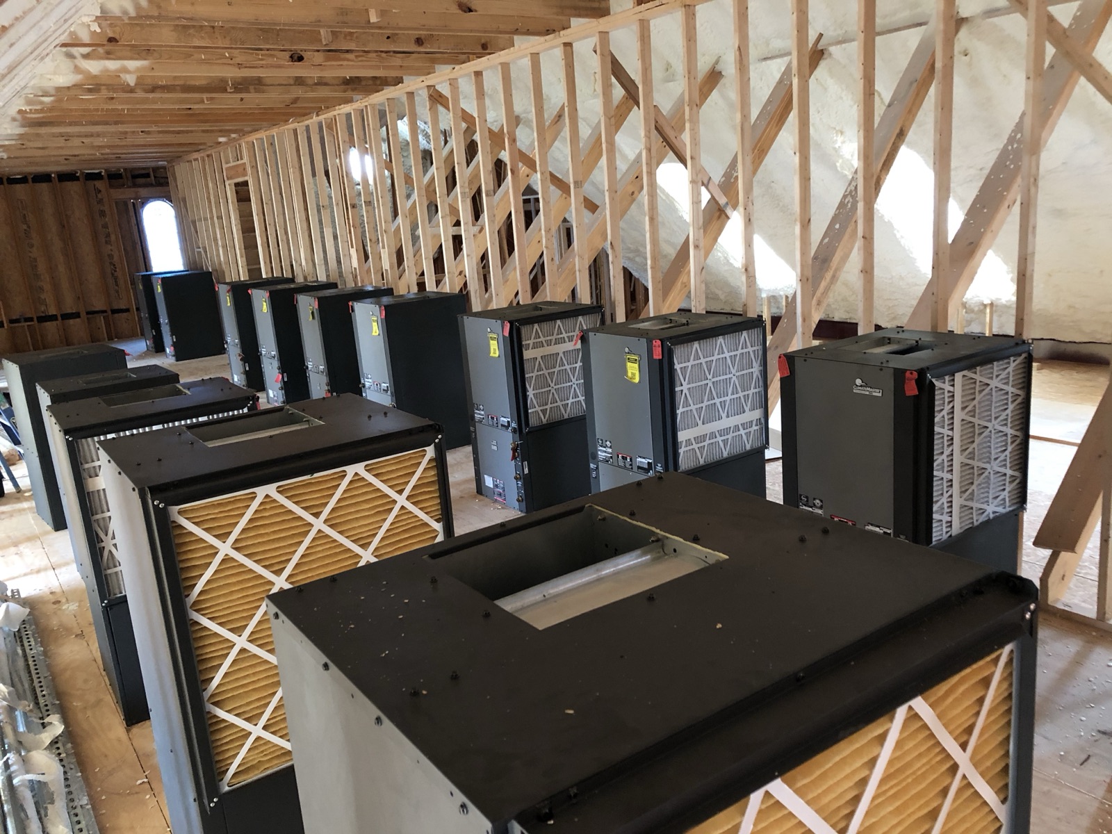 Geothermal heat pump units staged in an Excel Geothermal warehouse before installation in DFW homes